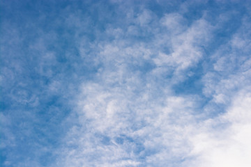 White clouds in the blue sky. Abstract background.