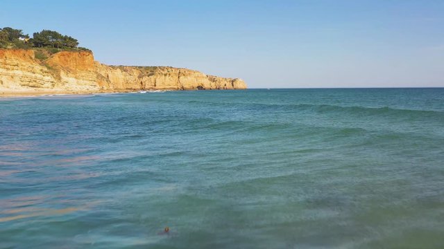 Fast speed Flight Over Atlantic Ocean Waves at Do Camilo beach, Lagos, Algerve, Portugal