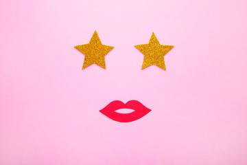Photo booth props lips with stars on pink background, top view