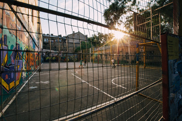 ODESSA, UKRAINE. Children playing soccer at sunset