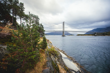 Classic Norwegian cold panoramic landscape of Efjorden fjord, Ballangen municipality, Nordland county, Ofoten district, Norway with Efjord Bridges, Stortinden mountain, Northern Norway