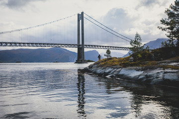 Classic Norwegian cold panoramic landscape of Efjorden fjord, Ballangen municipality, Nordland county, Ofoten district, Norway with Efjord Bridges, Stortinden mountain, Northern Norway