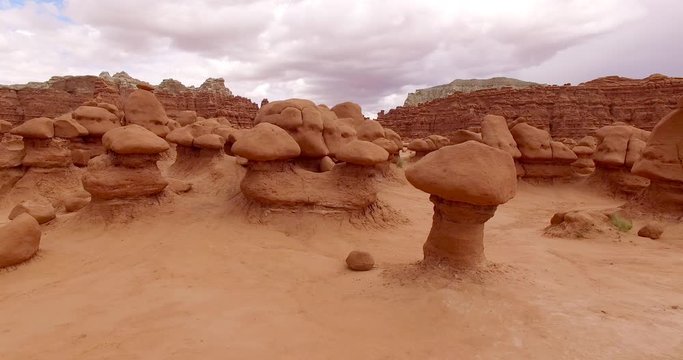 GOBLIN VALLEY STATE PARK, UTAH, USA. Aerial drone shot of strange and unique rock sculptures. Colorful balanced rocks, spires and pedestals amidst the solitude of the Great Basin Desert.