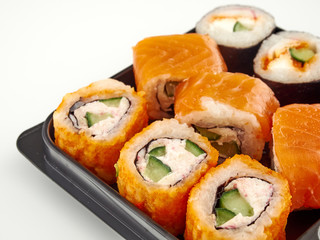 California rolls in a disposable container, fast food.Isolate white background