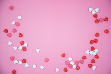 Heart shape candy on pink background. Valentines day concept. 
