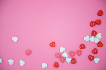 Heart shape candy on pink background. Valentines day concept. 