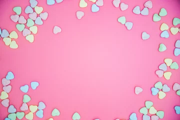 Rolgordijnen Heart shape message letter candy on pink background. Valentines day concept.  © Anna