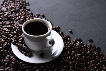 Coffee cup and beans on old grey kitchen beton , rock table. with copyspace for your text