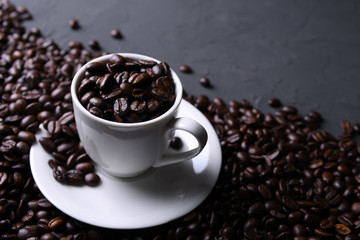 Coffee cup and beans on old grey kitchen beton , rock table. with copyspace for your text