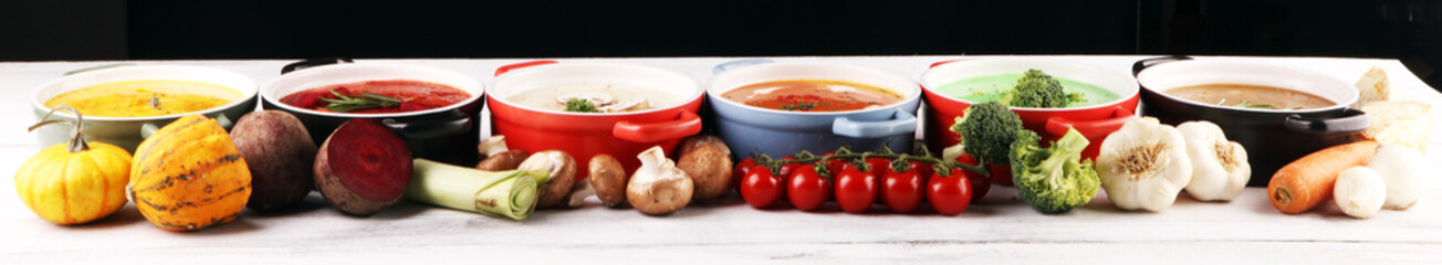 Variety of colorful vegetables cream soups and ingredients for soup. Concept of healthy eating or vegetarian food with mushrooms