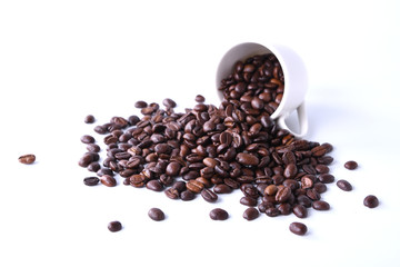 Coffee beans and cup of coffee isolated on white background