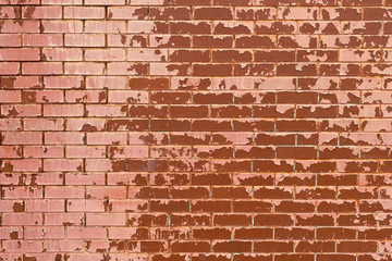 Naklejka premium faded red painted brick wall