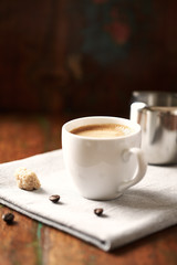 Cup of coffee on rustic wooden background