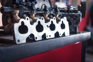 cleaned intake manifold before installing on a car in the workshop