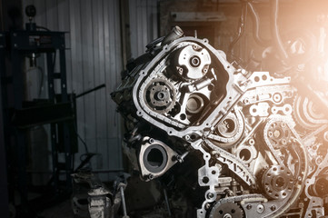 Fototapeta na wymiar New car timing kit on removed engine in workshop