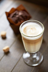 Caffe latte on brown background. 