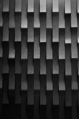 Abstract minimalist curve lines seamless modern architecture pattern made of black folded paper