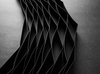 Abstract minimalist curve lines seamless modern architecture pattern made of black folded paper