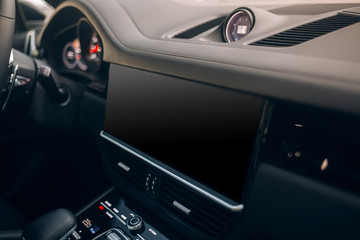 Modern car interior with dashboard and big monitor screen