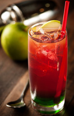Red Drink, Green Apple, Ice in Long Glass