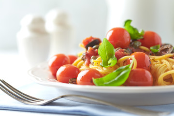 Spaghetti pasta with vegetable sauce. Bright background