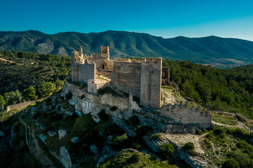 Aerial panorama view of Alcala de Xivert (Alcalá de Chivert) medieval Templar knight castle ruins in Valencia province Spain