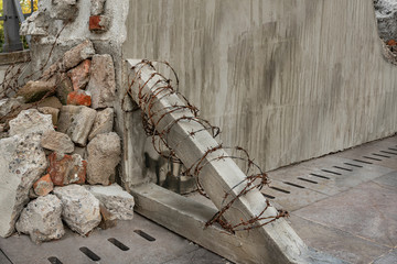 Barbed wire in political barricade. Asking for freedom in concrete wall	