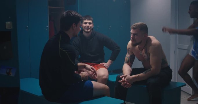 Men talking in locker room
