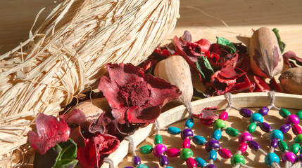 Close up of tree of life on handcraft dreamcatcher with decorative red dried leaves. relax senses