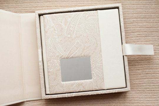 Elegant beige book and box for it. Wedding photobook. Wedding photo album