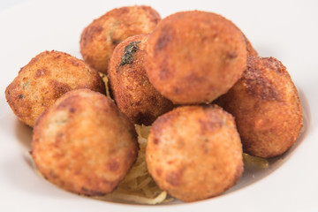Fototapeta premium Salt Cod Croquettes balls with straw potatoes