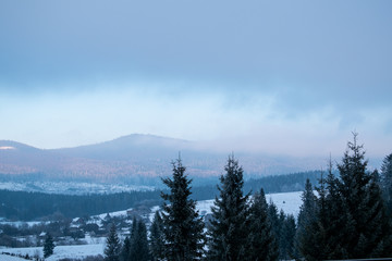 Winter in the mountains. Sky in the clouds. Ukrainian Carpathian Mountains