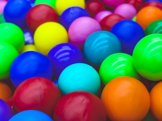 Bright multi-colored balls for the pool for childrens games.