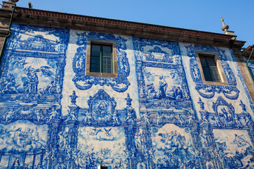 Beautiful antique wall of the Chapel of Souls of Santa Catarina decorated with traditional portuguese azulejos