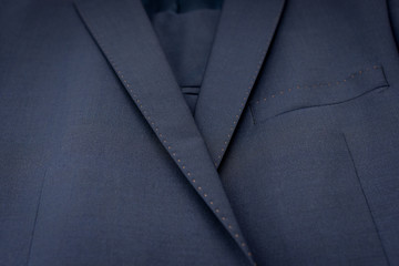 Classic dark blue formal suit close up.
