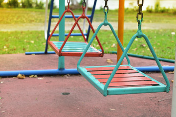swing steel seat in playground for kid playing in outdoor park