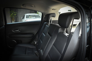 black leather of back seat interior inside modern vehicle car automobile