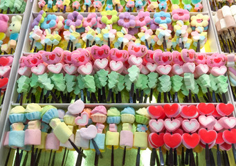 Colorful marshmallows on a sticks. Gummy, sugar