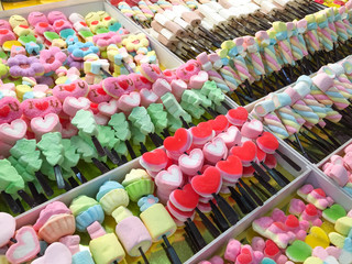 Colorful marshmallows on a sticks. Gummy, sugar