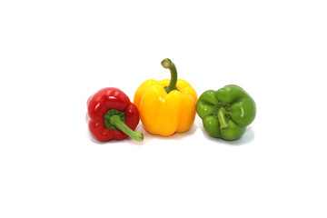 Sweet peppers, colorful vegetables placed on a white background
