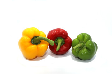 Sweet peppers, colorful vegetables placed on a white background