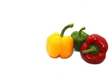 Sweet peppers, colorful vegetables placed on a white background