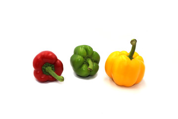 Sweet peppers, colorful vegetables placed on a white background