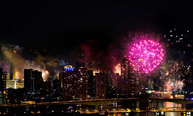 Coming in Happy New Year 2020 , background sparks on fireworks colorful in the night sky. night beautiful for festival party.