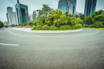 Obraz premium asphalt pavement with modern urban background ,guangzhou ,China