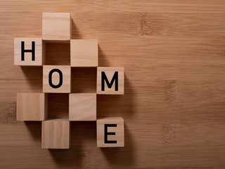 HOME concept with wooden block on wooden