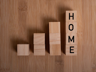 HOME concept with wooden block on wooden