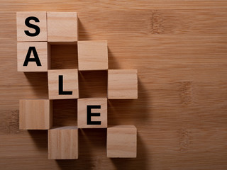 SALE banner concept: word build from wooden cubes with letters