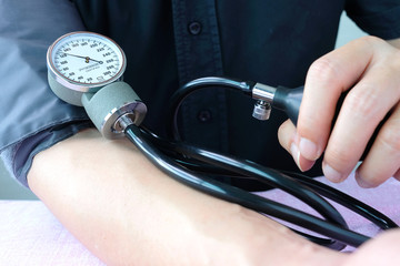 Doctor woman check blood pressure monitor and heart rate monitor pressure gauge. Health care and ...