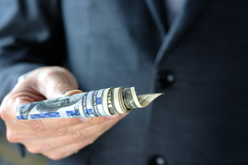 Business man's hand works for the money, He offer banknotes with partner for investment business, He count the dollar for bill payment. Exchange money. Financial concepts , Business Concept.